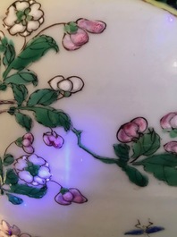 A pair of Chinese famille rose black-ground vases and covers, Yongzheng