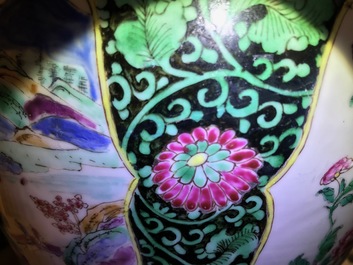 A pair of Chinese famille rose black-ground vases and covers, Yongzheng
