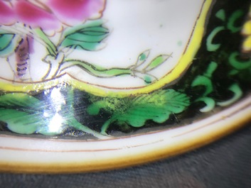 A pair of Chinese famille rose black-ground vases and covers, Yongzheng