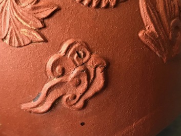 Two Chinese Yixing stoneware teapots with applied floral design, Kangxi