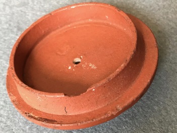 Two Chinese Yixing stoneware teapots with applied floral design, Kangxi
