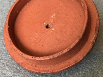 Two Chinese Yixing stoneware teapots with applied floral design, Kangxi