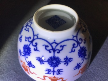 A pair of Chinese iron red and blue cups and a bowl, Qianlong and Guangxu marks, 19/20th C.