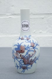 A Chinese blue and underglaze red 'sanduo' vase, Kangxi mark, 19/20th C.