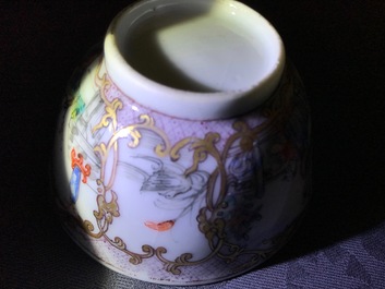A Chinese famille verte teapot and milk jug, 19th C., and a famille rose cup and saucer, Qianlong