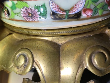 A pair of Chinese gilt-bronze mounted famille rose celadon vases, 19th C.