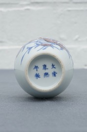 A Chinese blue and underglaze red 'sanduo' vase, Kangxi mark, 19/20th C.