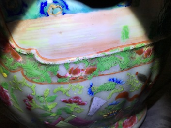 A pair of Chinese Canton famille rose celadon-ground vases, 19th C.