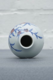 A Chinese blue and underglaze red 'sanduo' vase, Kangxi mark, 19/20th C.