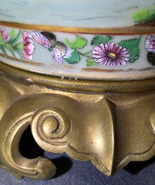 A pair of Chinese gilt-bronze mounted famille rose celadon vases, 19th C.