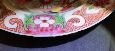 A Chinese famille rose plate with figures around a carriage, Yongzheng
