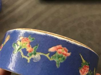 A Chinese blue-ground famille rose four-tier box, Tongzhi mark, 19th C.