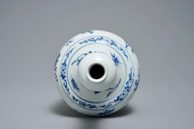 A Chinese blue and white bottle vase with floral design, Transitional period
