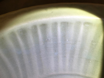 A Chinese Longquan celadon charger with underglaze dragon, Ming