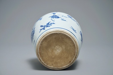A Chinese blue and white bottle vase with floral design, Transitional period