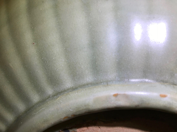 A Chinese Longquan celadon charger with underglaze dragon, Ming