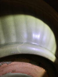 A Chinese Longquan celadon charger with underglaze dragon, Ming
