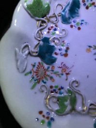 Two Chinese famille rose tea caddies and a relief-decorated cup and saucer, Yongzheng/Qianlong