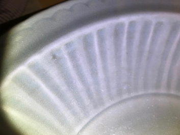 A Chinese Longquan celadon charger with underglaze dragon, Ming
