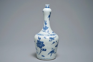 A Chinese blue and white bottle vase with floral design, Transitional period