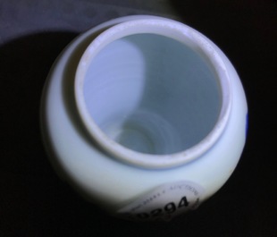 A pair of Chinese blue and white miniature vases and covers or tea caddies, Kangxi