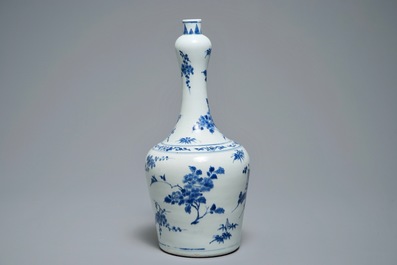 A Chinese blue and white bottle vase with floral design, Transitional period