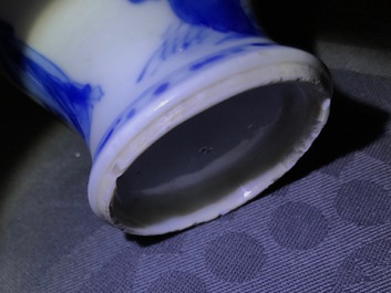 A pair of Chinese blue and white miniature vases and covers or tea caddies, Kangxi