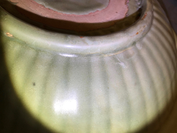 A Chinese Longquan celadon charger with underglaze dragon, Ming