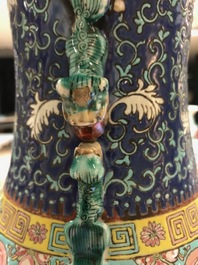 A pair of Chinese famille rose blue-ground vases, 19th C.