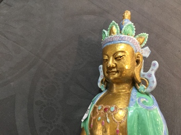 A Chinese parcel-gilt famille rose model of Buddha, 19th C.