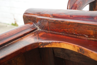 A Chinese elm wood "official's hat" armchair, 19th C.