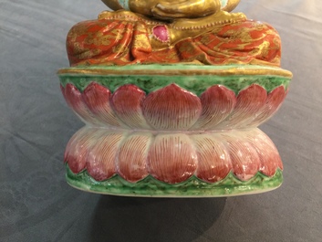 A Chinese parcel-gilt famille rose model of Buddha, 19th C.
