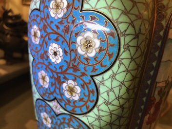 A pair of Chinese parcel-gilt cloisonn&eacute; vases on wooden stands, 1st half 20th C.