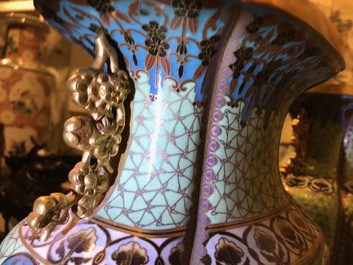 A pair of Chinese parcel-gilt cloisonn&eacute; vases on wooden stands, 1st half 20th C.