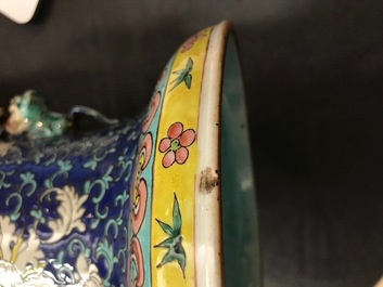 A pair of Chinese famille rose blue-ground vases, 19th C.
