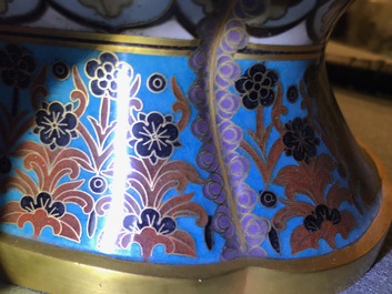 A pair of Chinese parcel-gilt cloisonn&eacute; vases on wooden stands, 1st half 20th C.