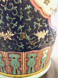 A pair of Chinese famille rose blue-ground vases, 19th C.