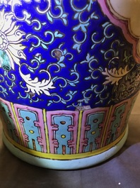 A pair of Chinese famille rose blue-ground vases, 19th C.
