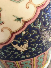 A pair of Chinese famille rose blue-ground vases, 19th C.
