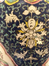 A pair of Chinese famille rose blue-ground vases, 19th C.