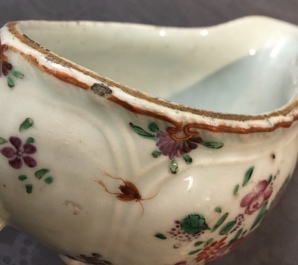 Eight Chinese famille rose plates, a teapot and a sauce boat, Qianlong