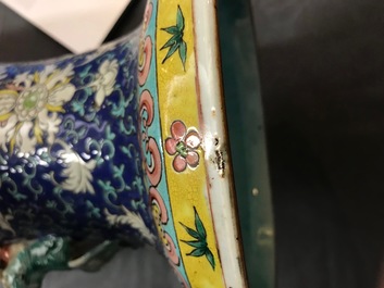 A pair of Chinese famille rose blue-ground vases, 19th C.
