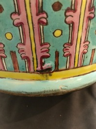 A pair of Chinese famille rose blue-ground vases, 19th C.