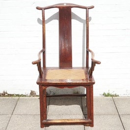 A Chinese elm wood "official's hat" armchair, 19th C.