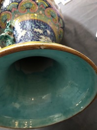 A pair of Chinese famille rose blue-ground vases, 19th C.