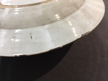 Eight Chinese famille rose plates, a teapot and a sauce boat, Qianlong