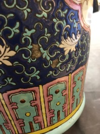 A pair of Chinese famille rose blue-ground vases, 19th C.