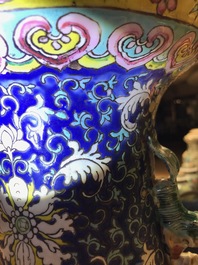 A pair of Chinese famille rose blue-ground vases, 19th C.