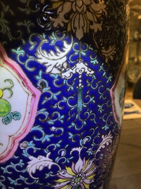 A pair of Chinese famille rose blue-ground vases, 19th C.