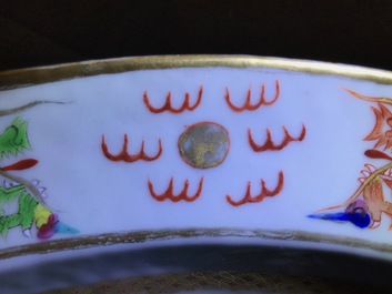 Three Chinese famille rose plates and an oval dish, 18/19th C.
